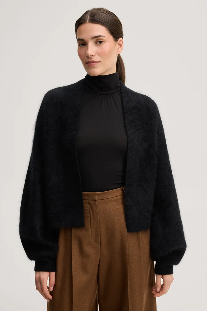 Leads to product detail page "Brushed cashmere cape jacket in black"