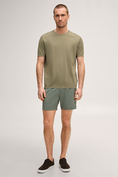 Leads to product detail page "Virgin wool swim shorts in olive green"
