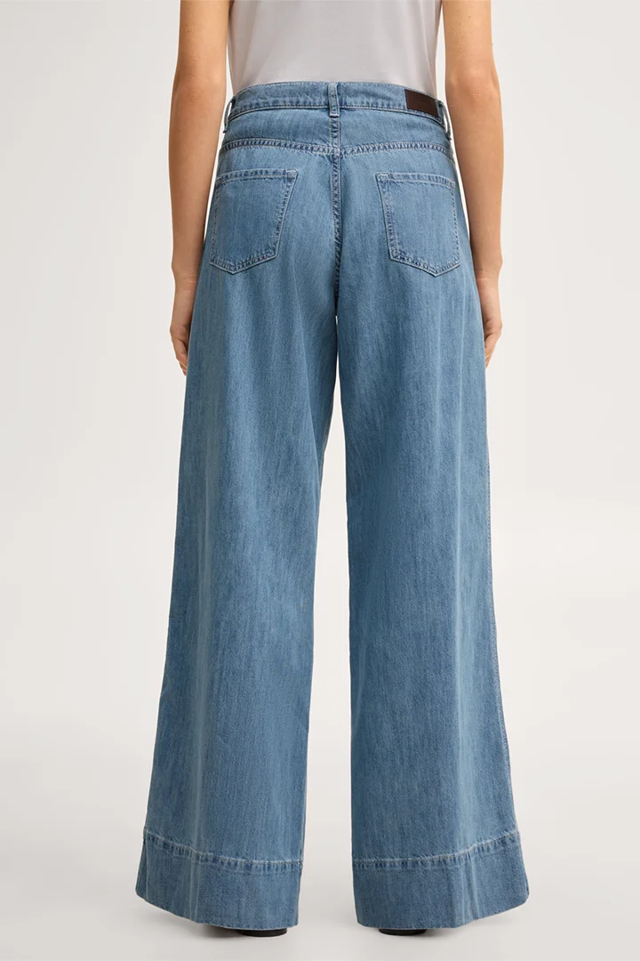 Leads to product detail page "Mid-blue washed palazzo jeans"