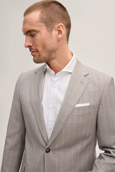 Leads to product detail page "Sera-Sole virgin wool suit in grey and brown stripes"
