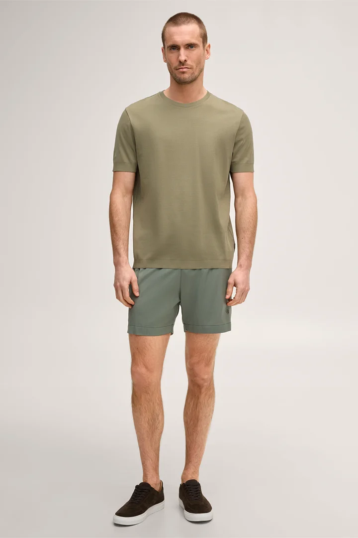 Leads to product detail page "Virgin wool swim shorts in olive green"
