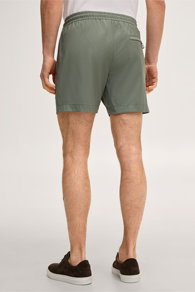 Leads to product detail page "Virgin wool swim shorts in olive green"