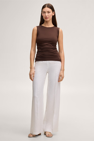 Leads to product detail page "Dark brown Tencel stretch top with ruffles"