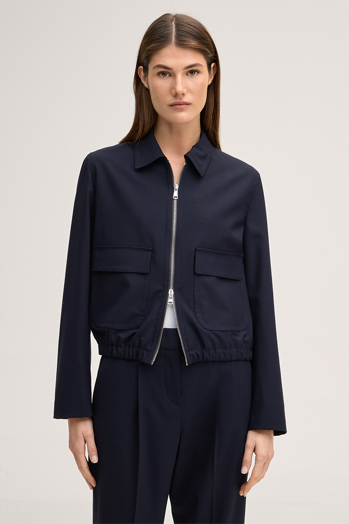 Leads to product detail page "Virgin wool stretch jacket with zip in navy"