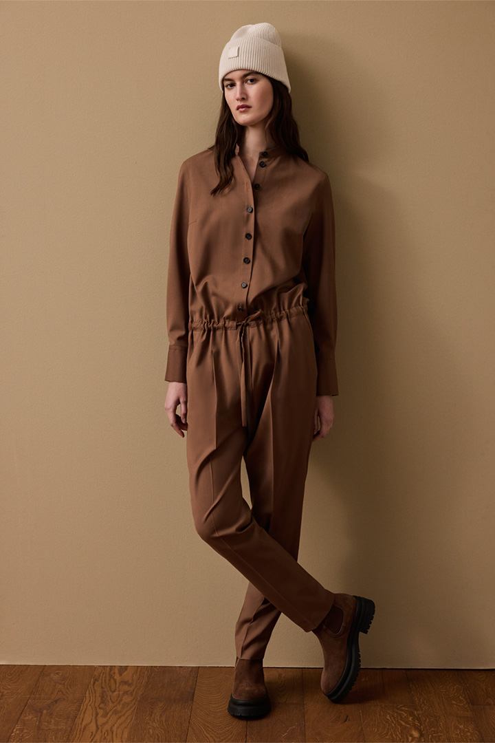 windsor. presents the look with the products Virgin Wool Overalls with Stand-up Collar in Brown, Knitted Merino Beanie in Cream and Suede Chelsea Boots in Cognac by Unützer