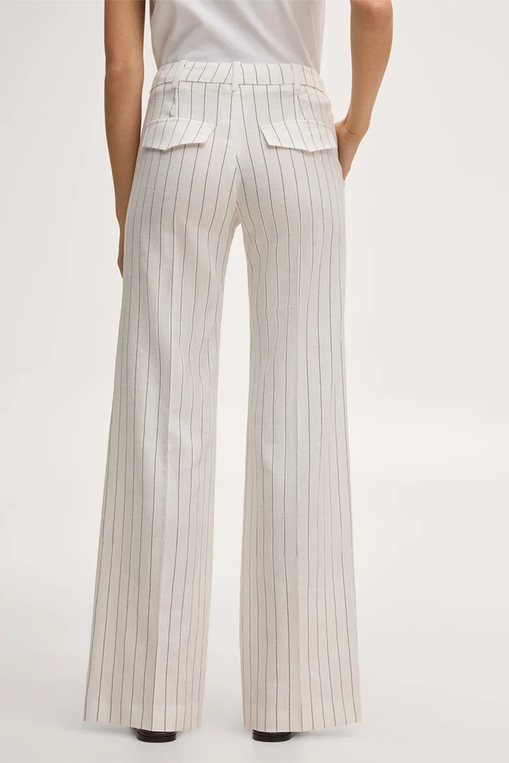 Leads to product detail page "Pinstriped linen-blend Marlene suit trousers in ecru"