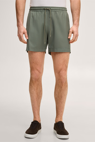 Leads to product detail page "Virgin wool swim shorts in olive green"