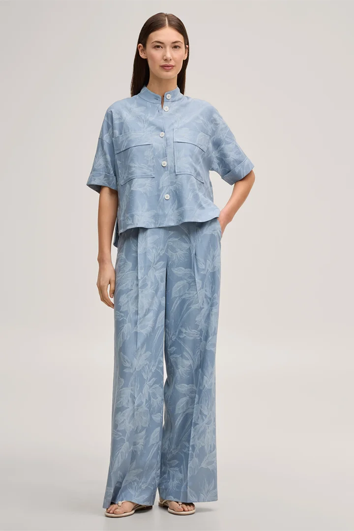 Leads to product detail page "Viscose-linen blend palazzo trousers in light blue and ecru"