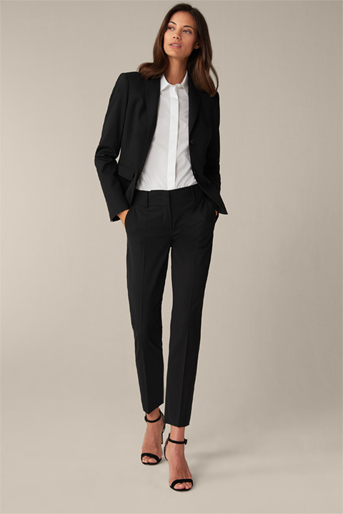 <p><strong>Shop the Look:</strong><br> Stretch virgin wool pantsuit in black</p>