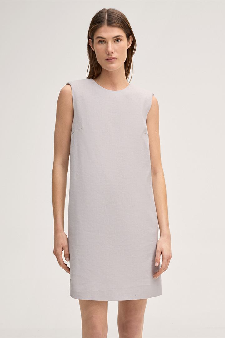 Leads to product detail page "Beige mini-length sleeveless stretch linen eggshape dress"