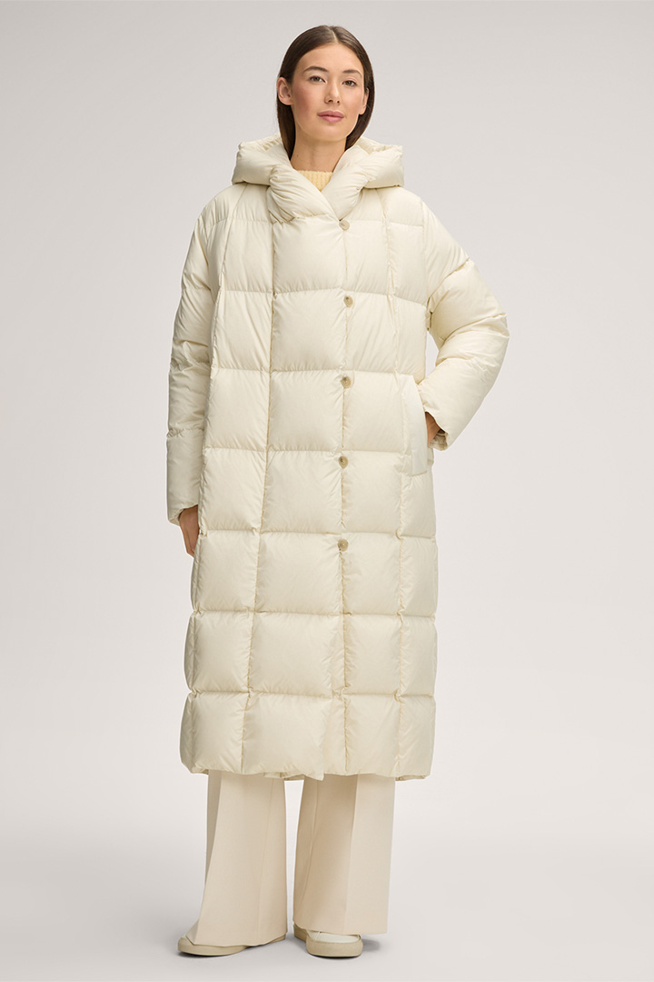 Leads to product detail page "Quilted Down Coat in Cream"