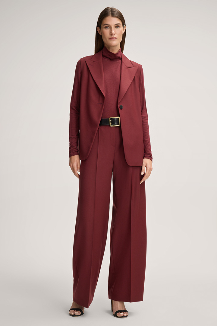 Leads to product detail page "Palazzo Virgin Wool Trousers in Red"