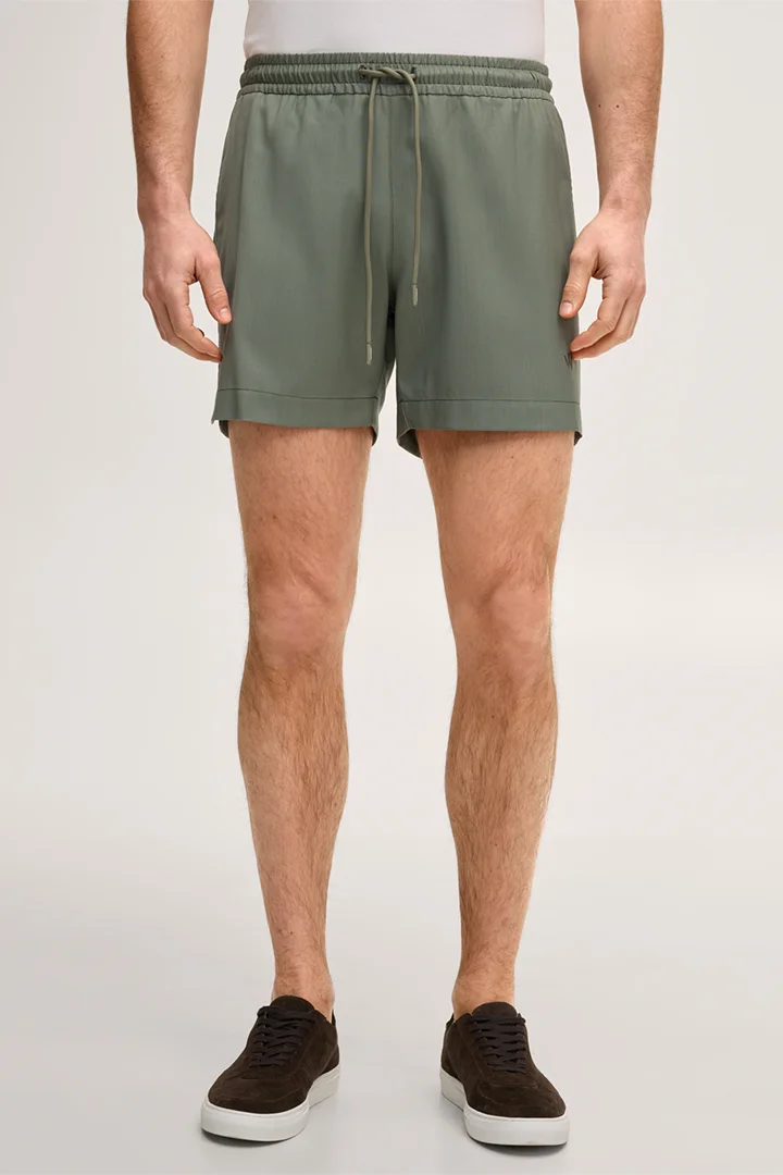 Leads to product detail page "Virgin wool swim shorts in olive green"